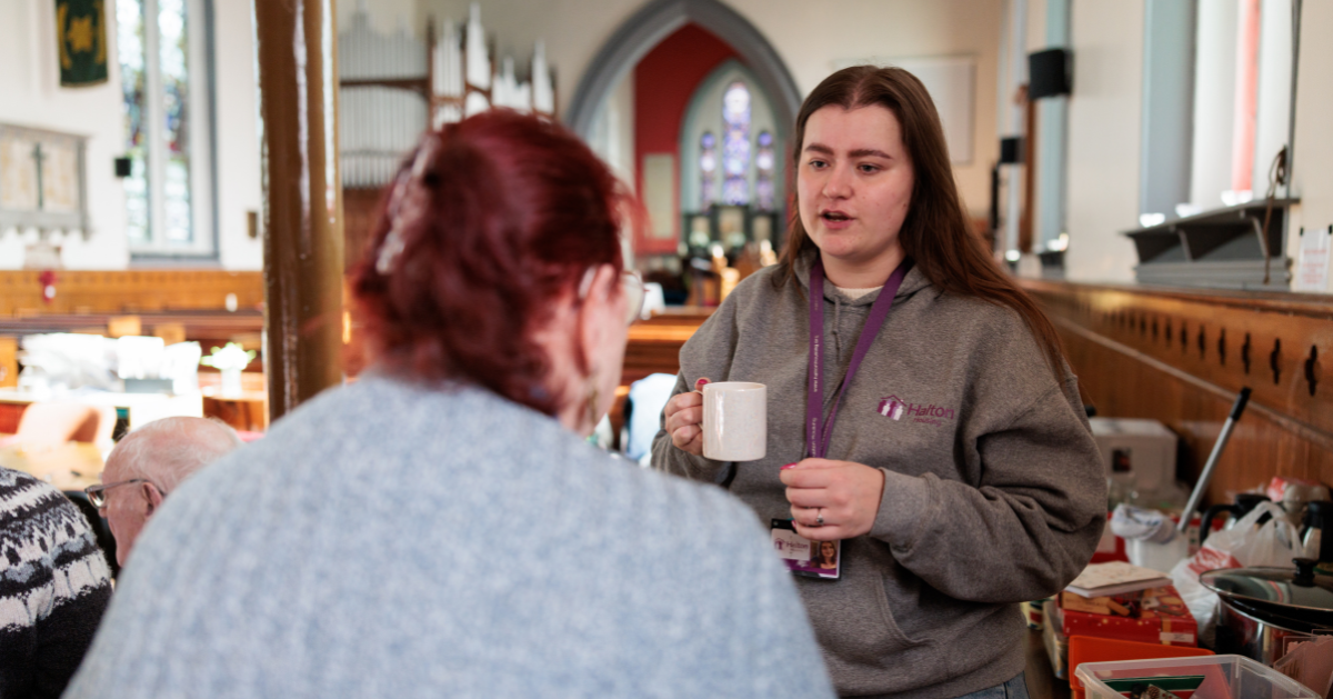 a member of neighbourhoods team speaking to a customer