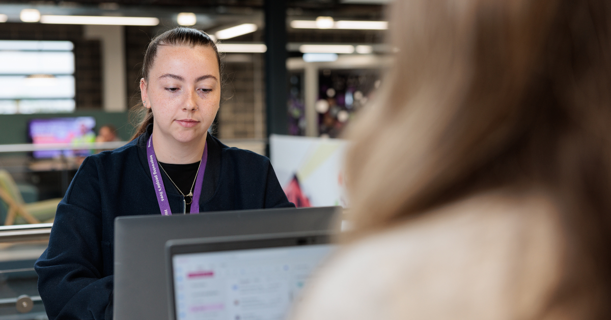 working at desk on laptop