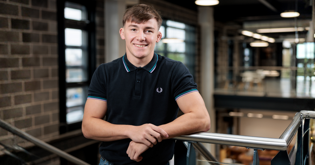 Young male apprentice in office